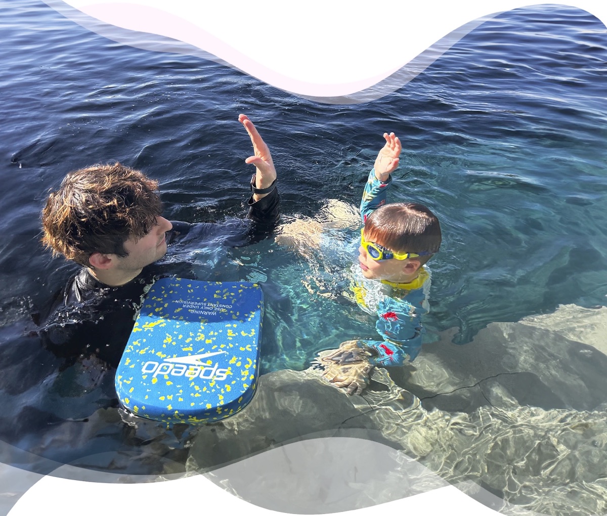 Nereids swim teacher student high five swimming progress