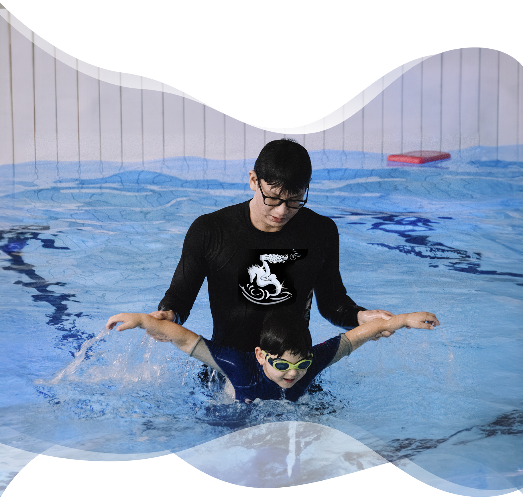 A Nereids swim teacher gently guides a student’s arms through butterfly technique during a stroke development lesson — showing personalised, hands-on learning.