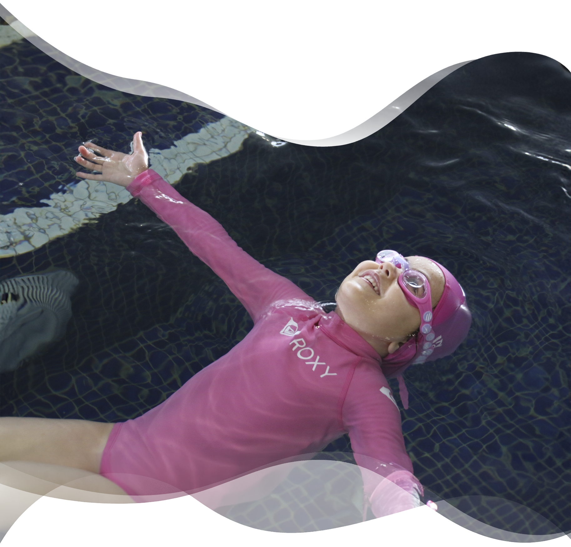 Preschool girl floating in a starfish position all by herself, showing calm confidence and independence after gentle guidance from her Nereids swim teacher.