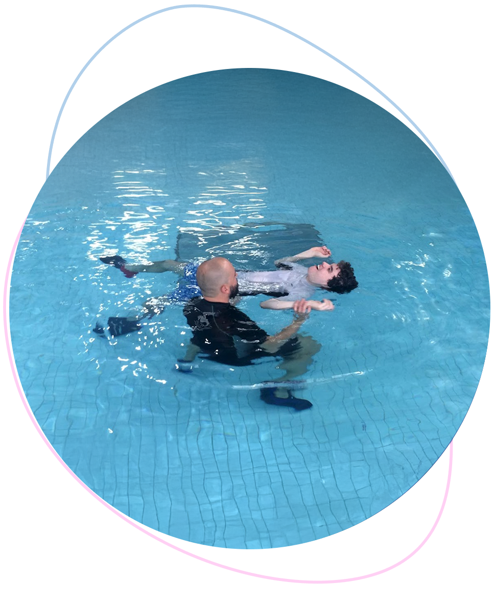 Adult beginner floating with slight nervousness while Nereids teacher offers gentle support for confidence