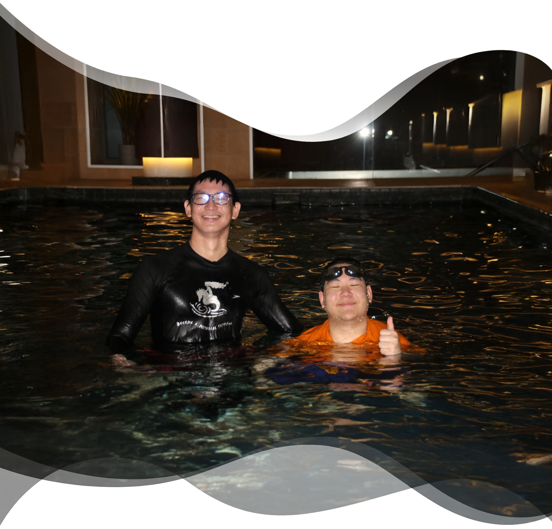 Happy adult student giving thumbs up with Nereids swim teacher after completing private lesson