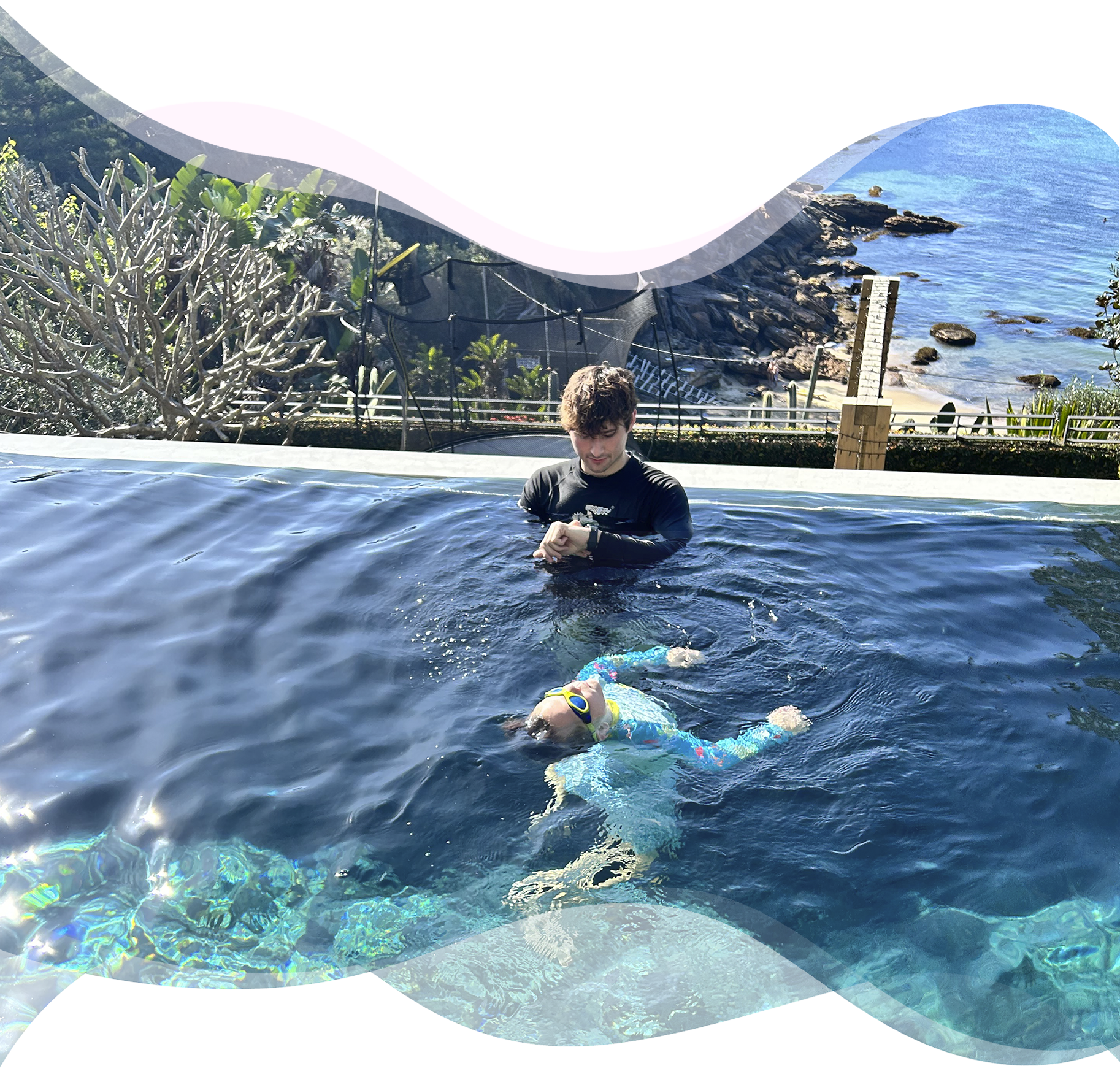 A young child treading water calmly while a Nereids swim teacher observes nearby, building trust, safety, and real deep-end confidence.